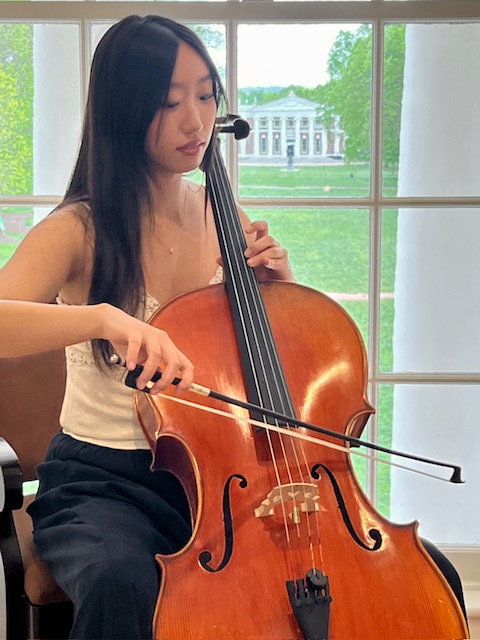 solo cellist in dome room with Old Cabell in background- spring2024