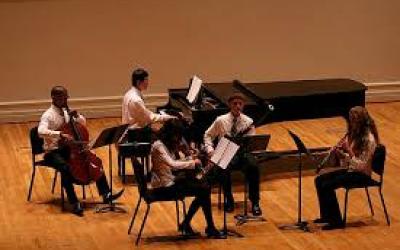 UVA students performing on the stage at Old Cabell Hall