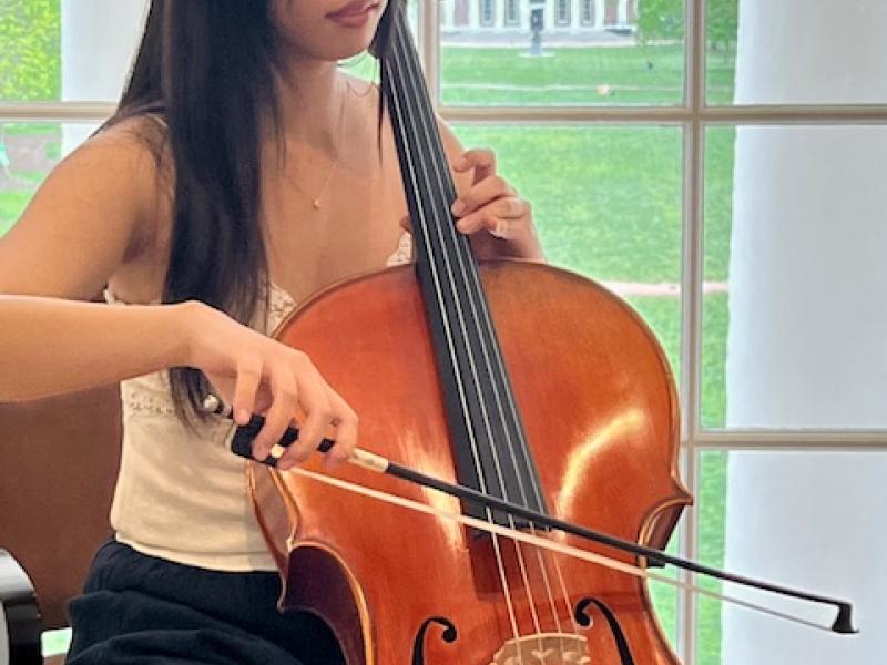 solo cellist in dome room with Old Cabell in background- spring2024