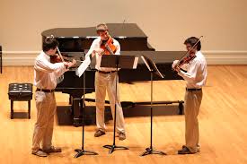 student string performers on old cabell hall stage