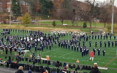 people watching the Cavalier Marching Band open rehearsal on Carr's Hill Field